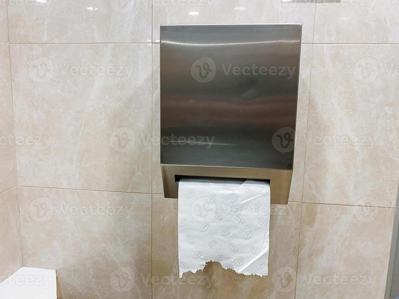 Wooden rectangle fixture for bathroom with stainless steel dispenser, composite material flooring, and glass transparency. photo