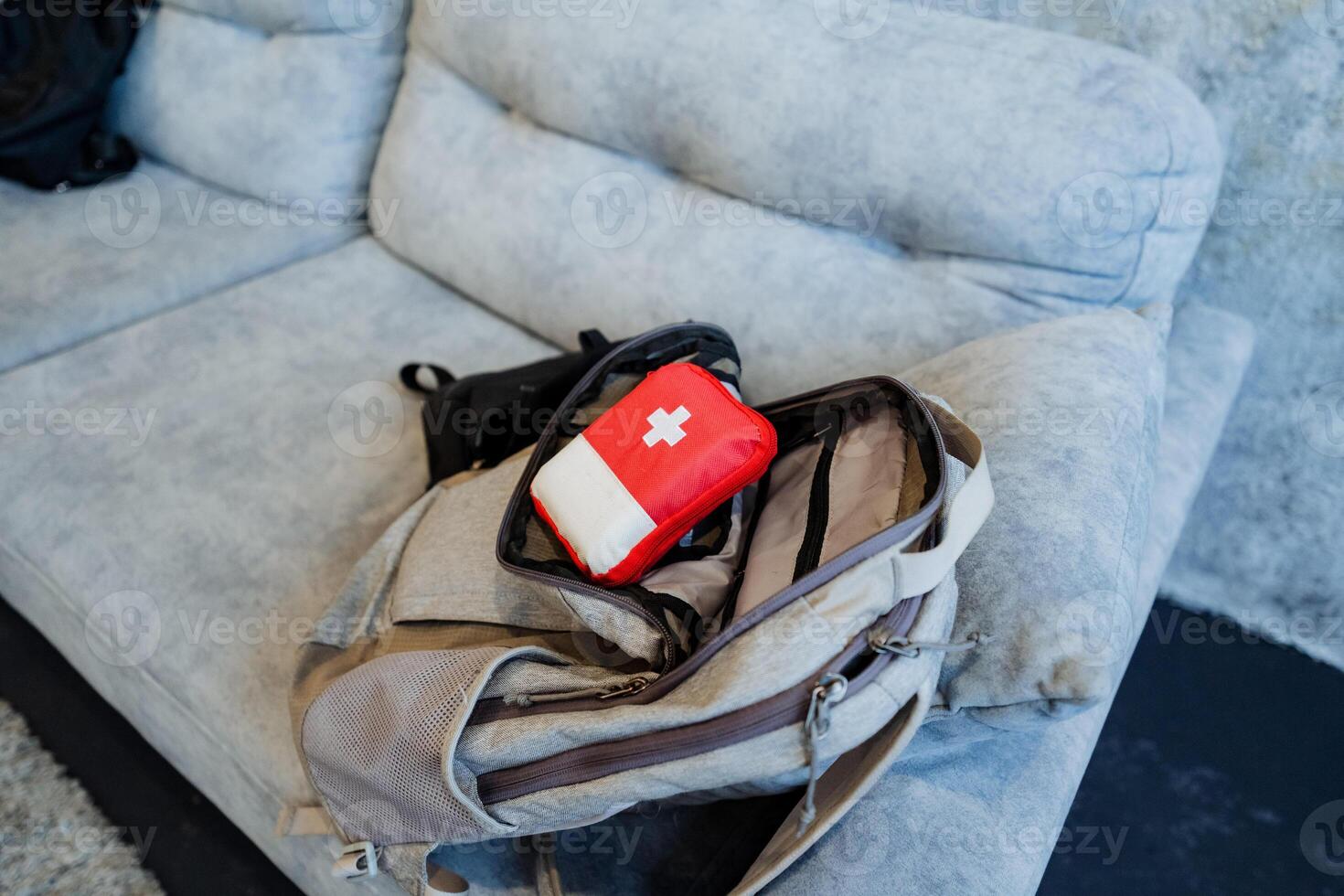 To get ready for a trip, a first aid kit is in a backpack, a tourist kit, equipment for the trip. photo