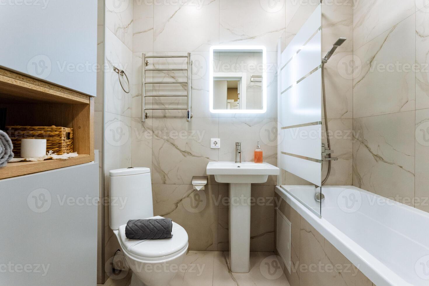 Discover a contemporary bathroom that showcases a chic shower and a comfortable bathtub, meticulously designed for both relaxation and convenience photo