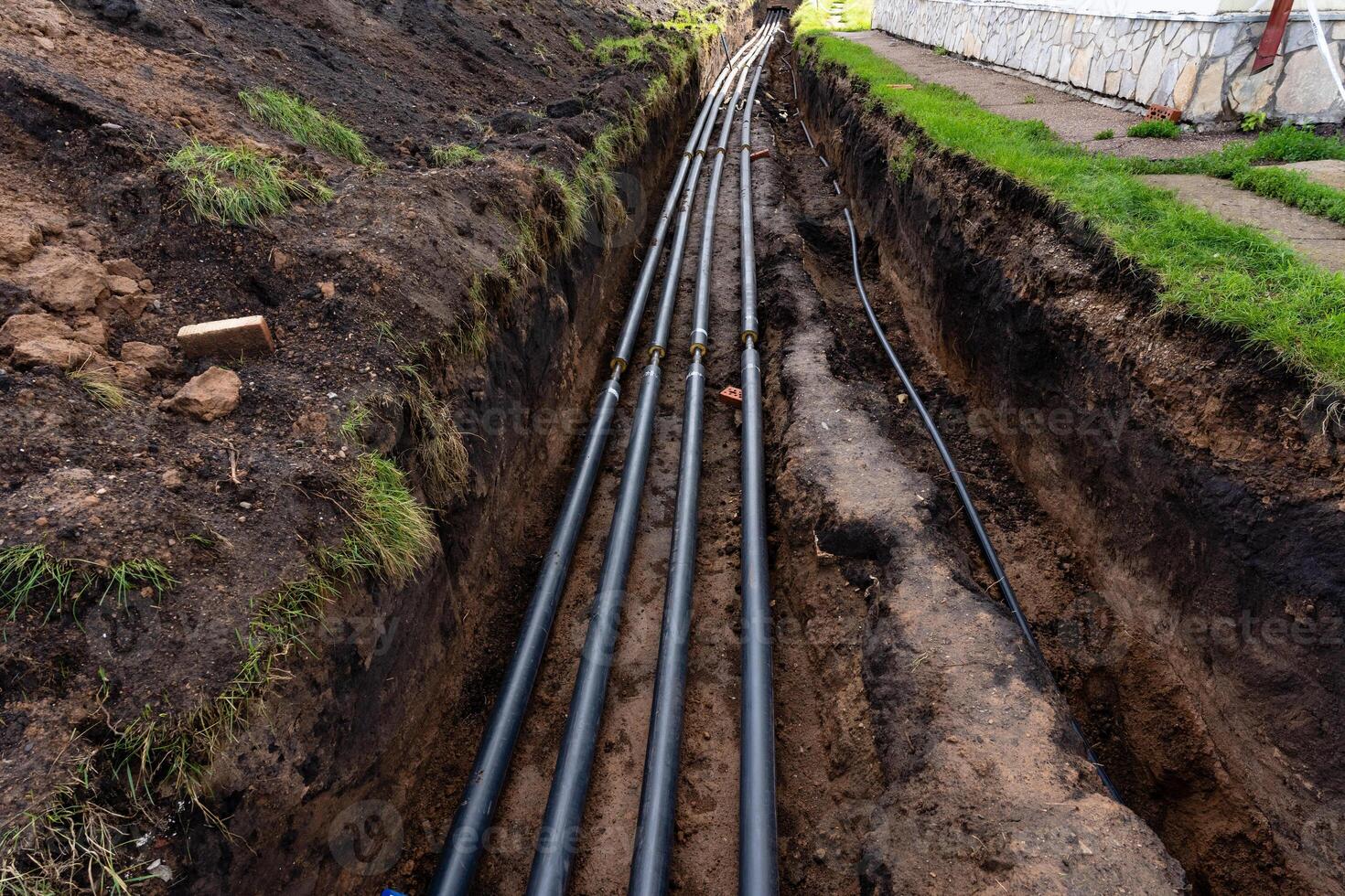 The Underground Installation of PVC Pipes within a trench is essential for various infrastructure projects photo