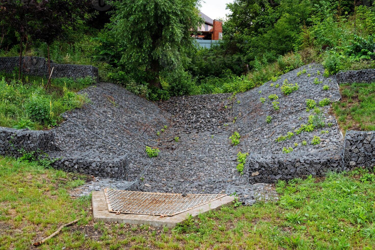 In a green grassy field, a pile of gravel serves as a distinctive feature, complementing the natural surroundings. It provides a unique visual contrast and adds character to the landscape photo
