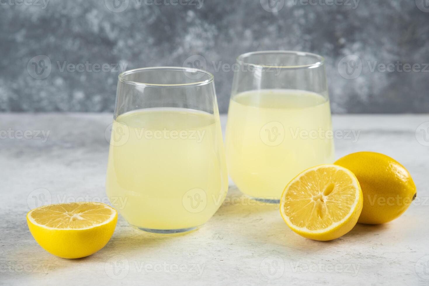 Two cups of fresh lemonade with lemon slices photo