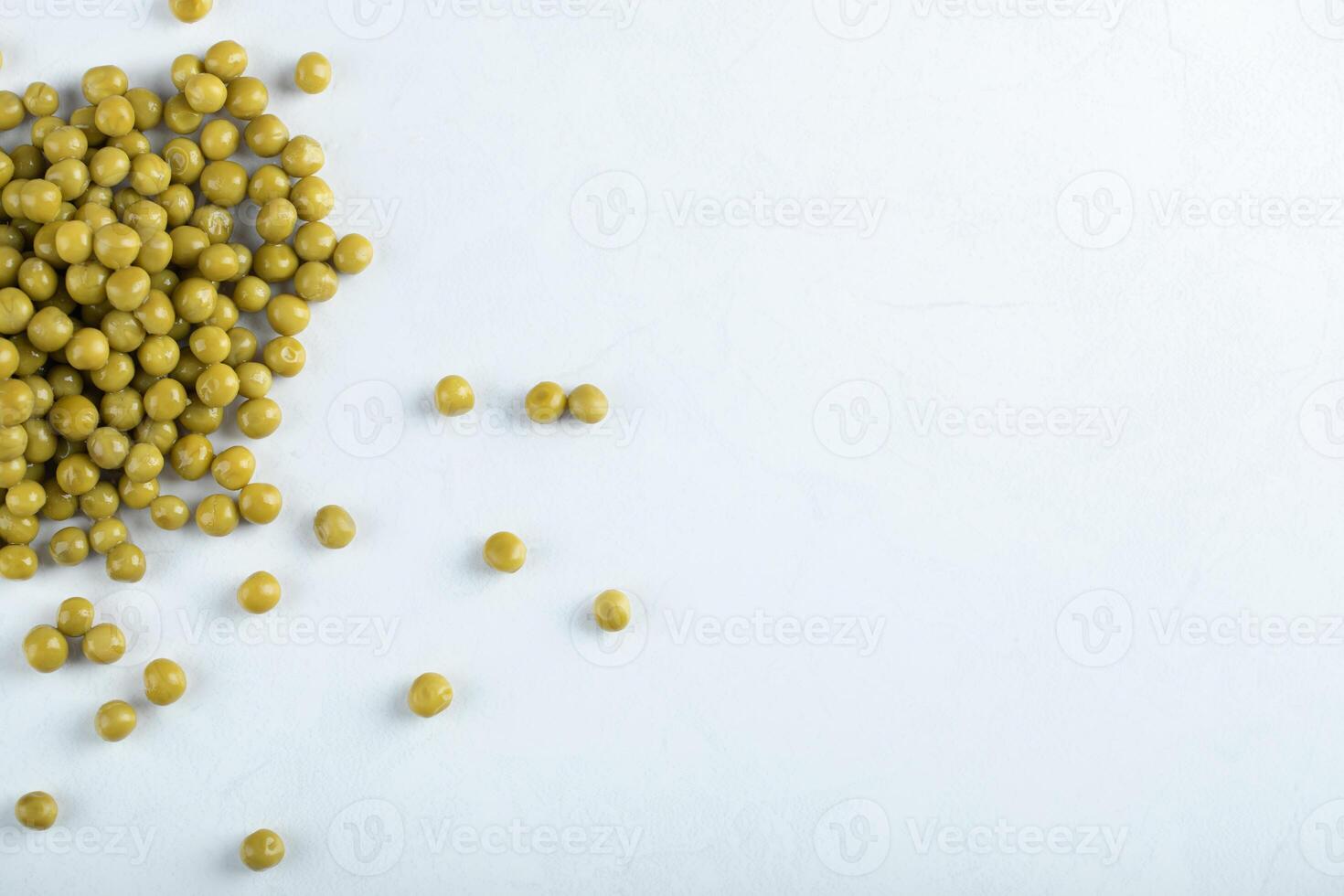 Top view. Healthy snack. Marinated green olives on white background photo