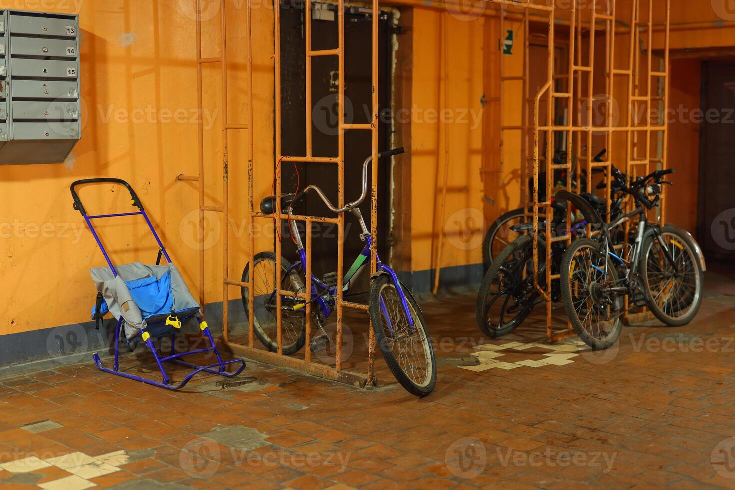 Bicycles and Strollers parked in an Urban Storage Area designed for community convenience photo