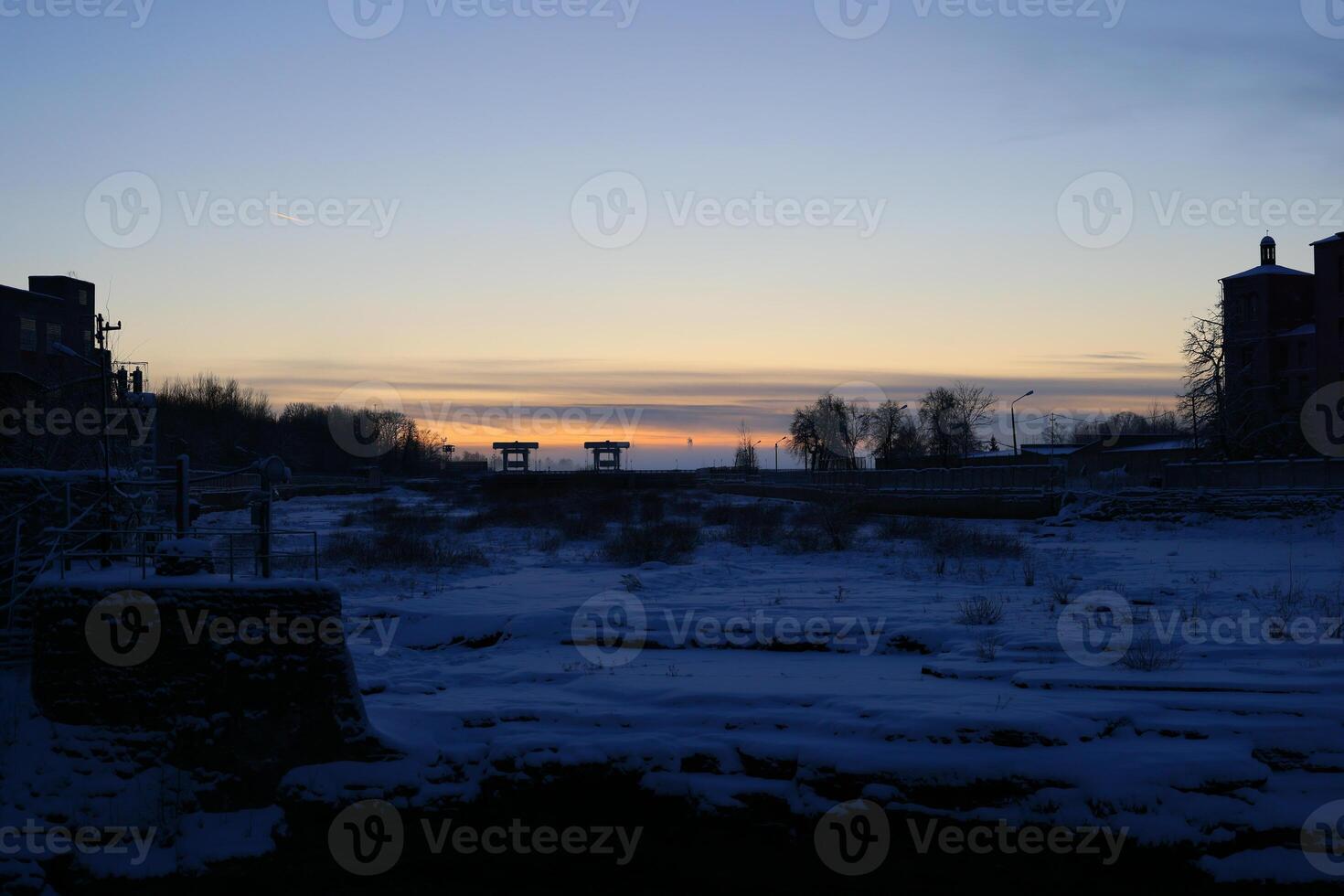 Serene and Beautiful Winter Sunset Over a Large, Desolate Landscape at Dusk and Twilight photo