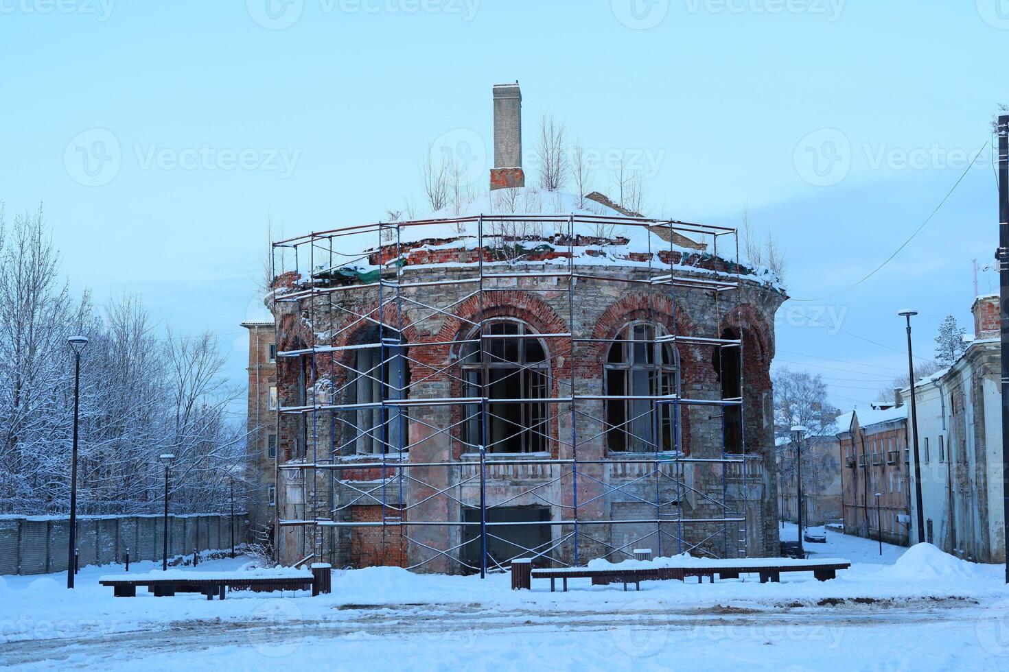 An Abandoned Structure in a Winter Landscape Captures Beauty and Desolation Artfully photo