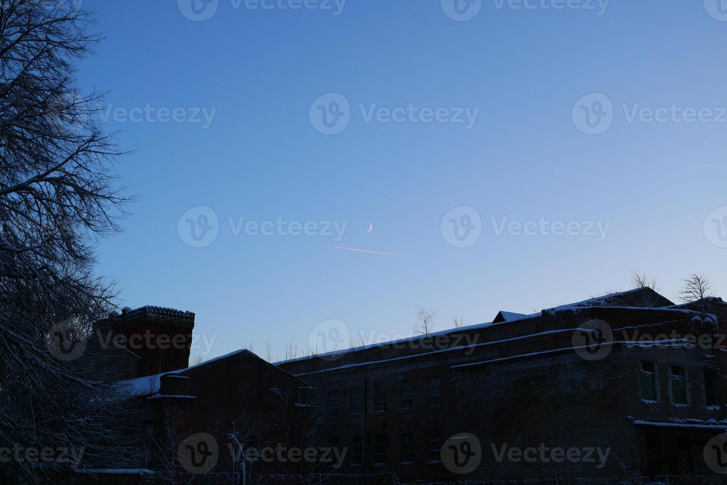 Twilight Serenity Over a Beautiful, SnowCapped Building Surrounded by Calmness and Beauty photo