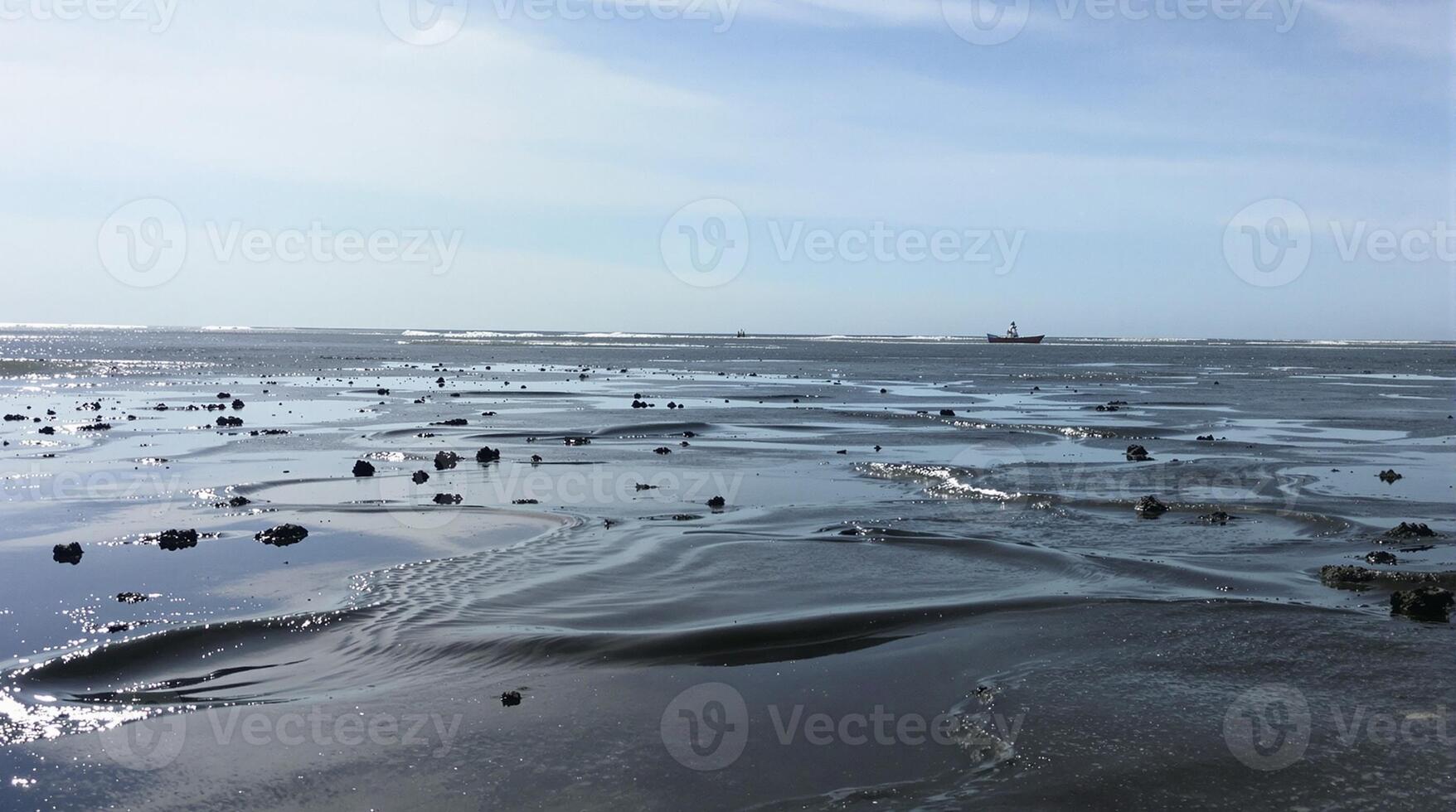 Experience a Serene Coastal View at Low Tide, where natures beauty is truly mesmerizing photo