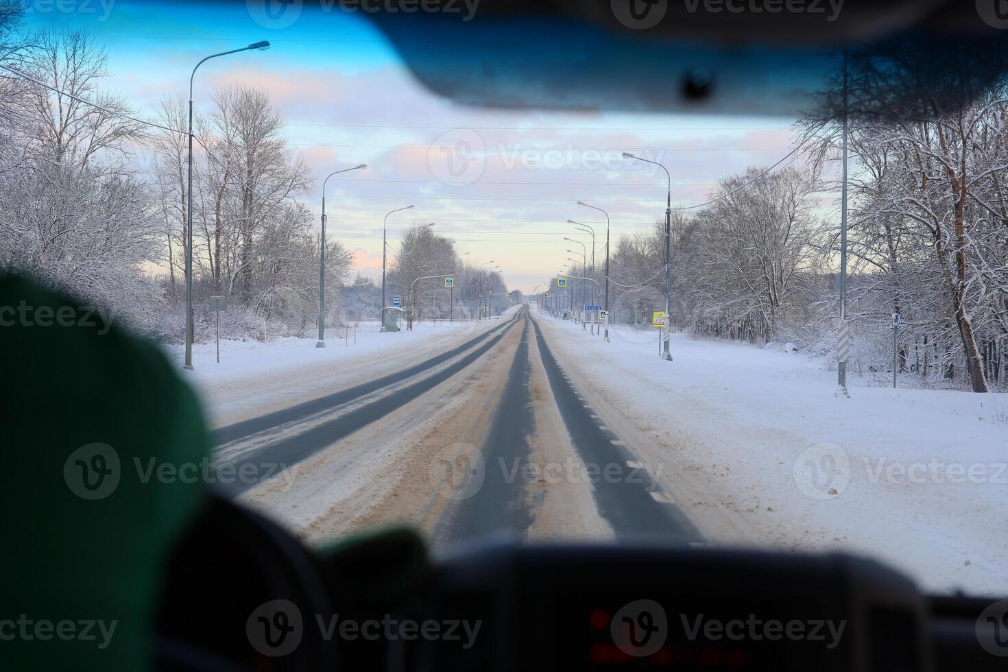Experiencing the exhilarating adventure of winter driving on a snowy road in a remote wilderness photo