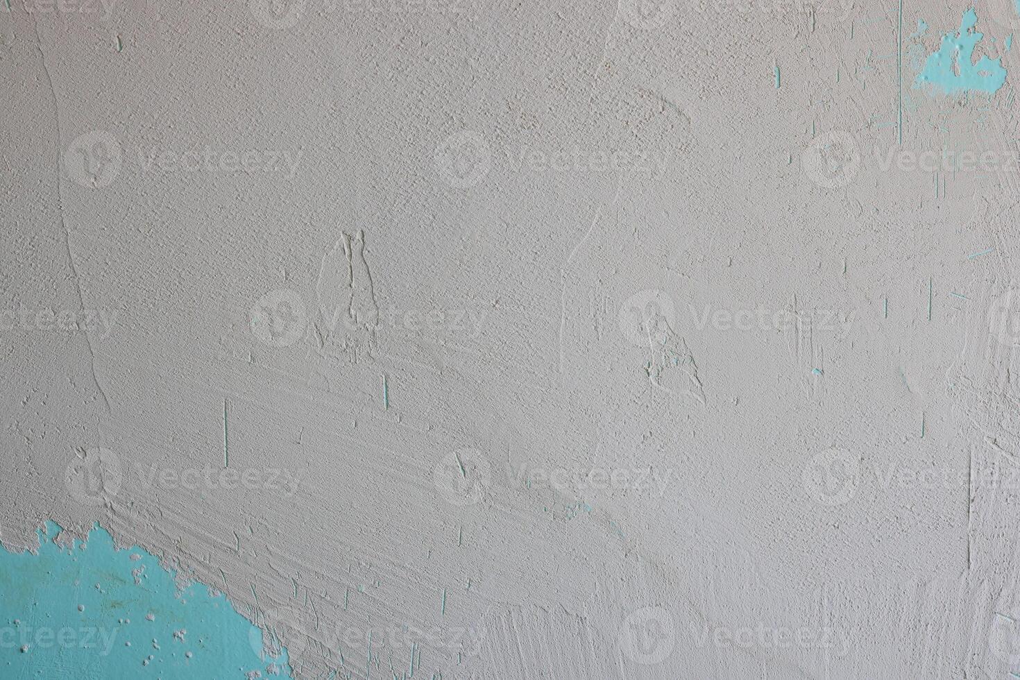 A textured wall with striking turquoise accents creates captivating visual appeal photo
