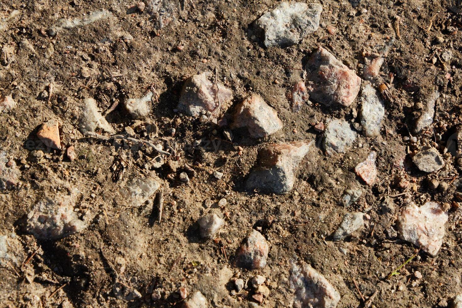 Natural Ground with a Mixture of Stones and Various Pebbles for a Unique Landscape photo