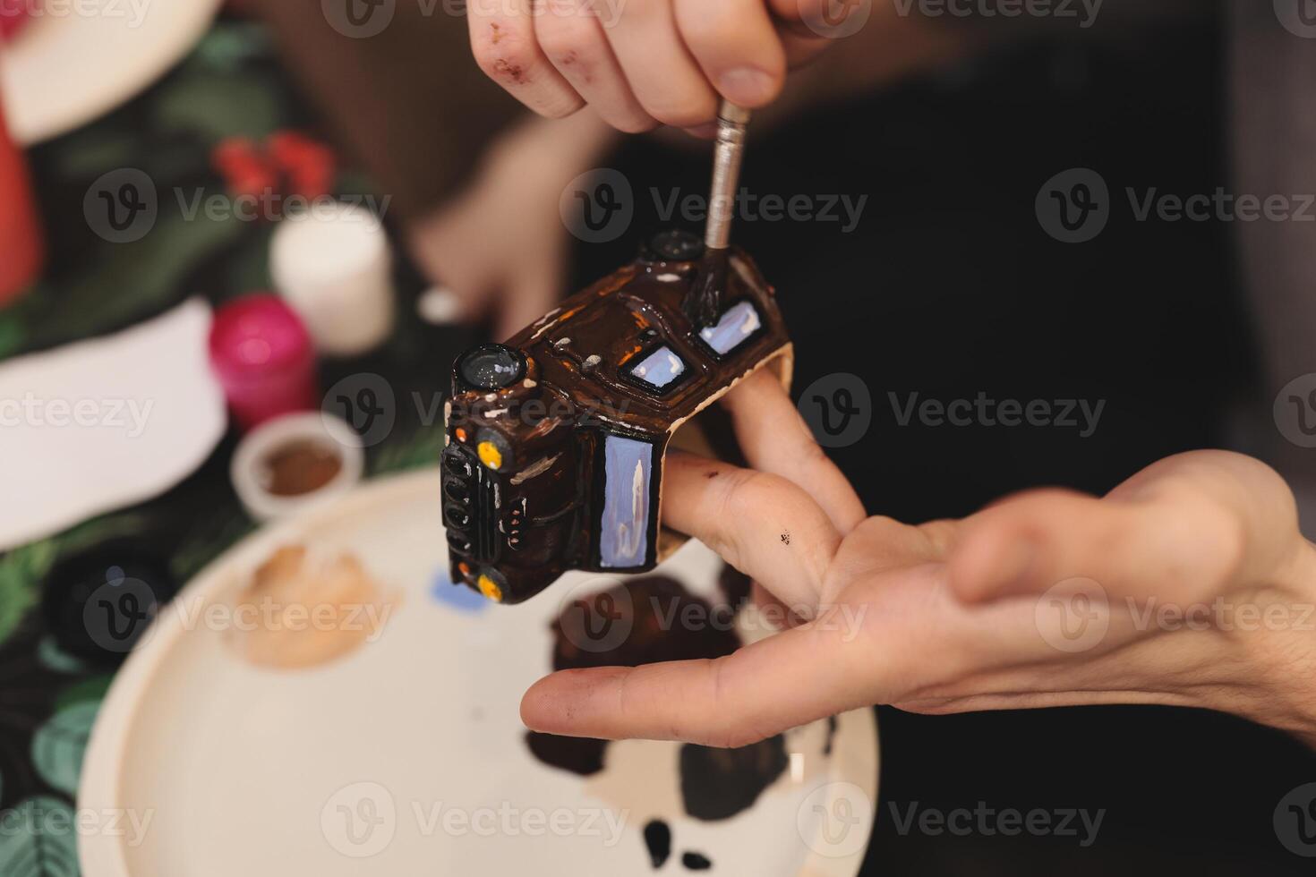 Creative Painting of a Miniature House for Artistic Projects and Innovative Ideas photo