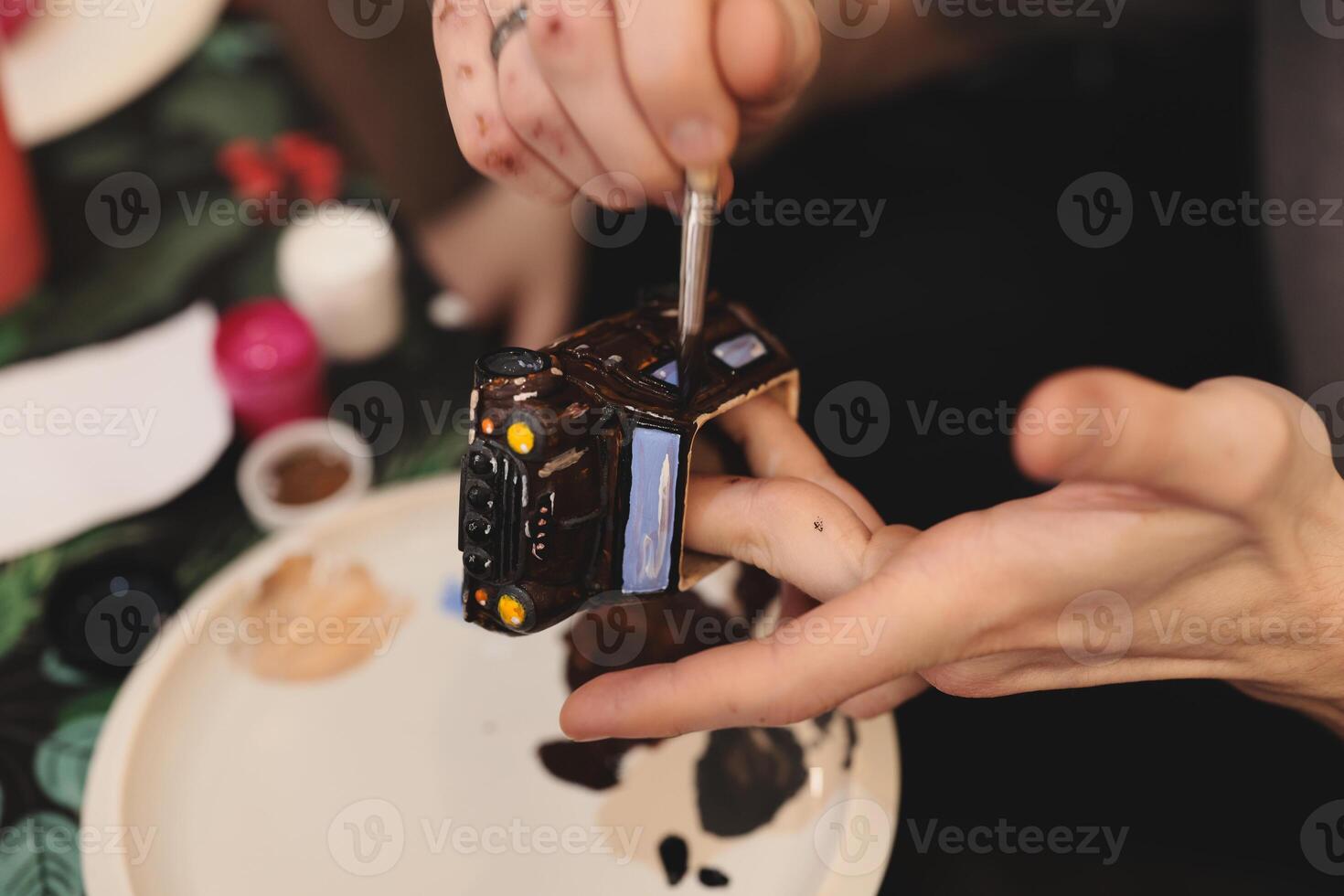 The Creative Painting Process Involved in Crafting a Beautiful Miniature Model Masterpiece photo