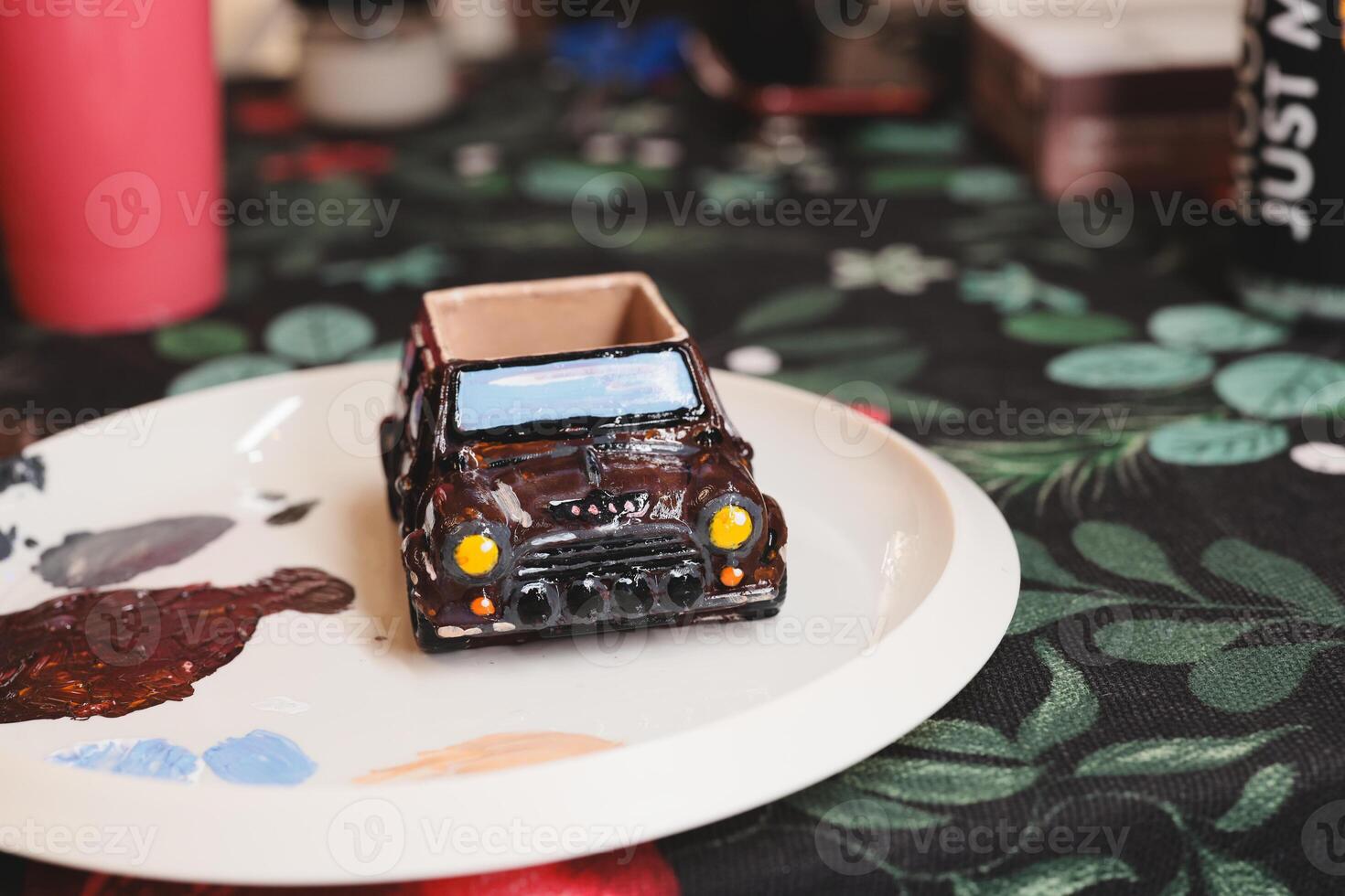 This is a HandPainted Miniature Car beautifully displayed on a Decorative Plate for decoration photo