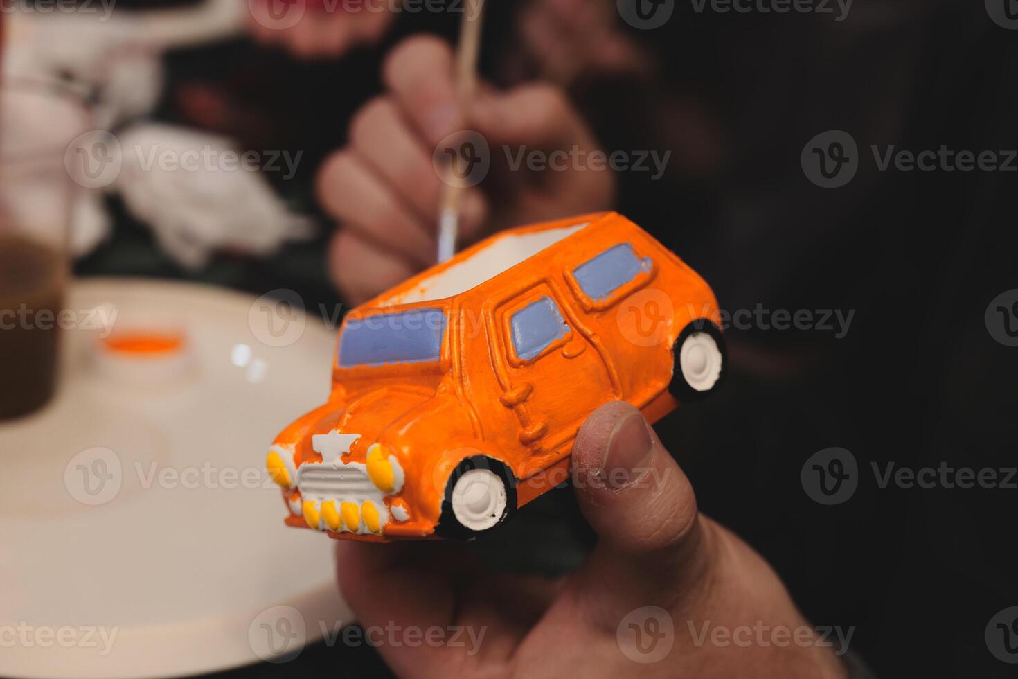 HandPainted Orange Toy Car Model Currently Being Created and Worked On in Progress photo