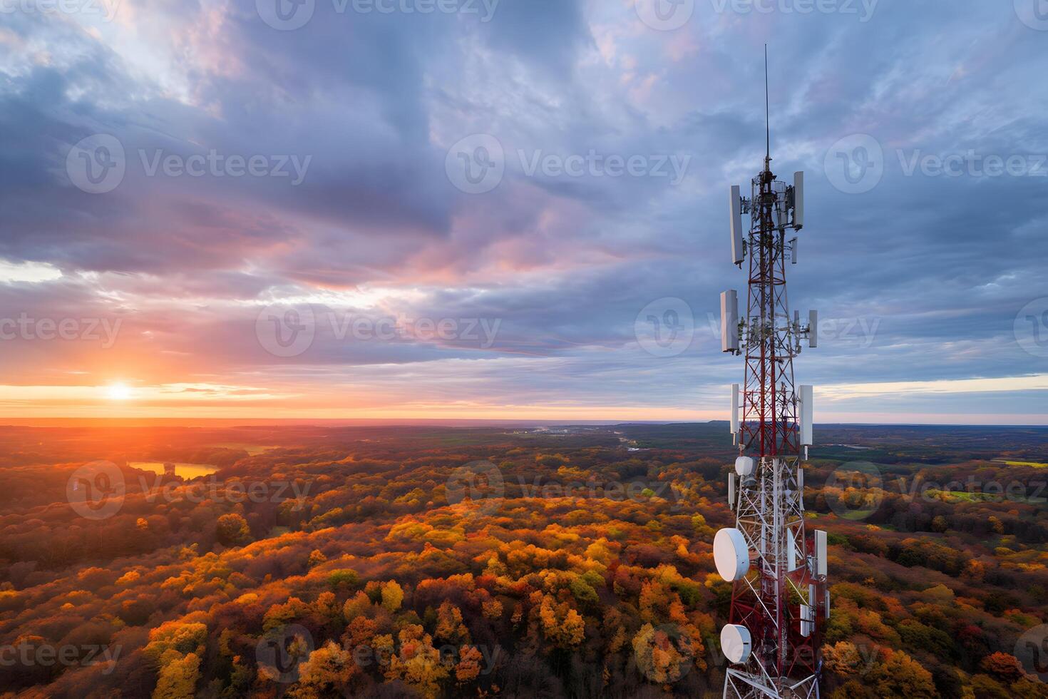 Communication tower above autumn forest blends technology with seasonal natural beauty photo