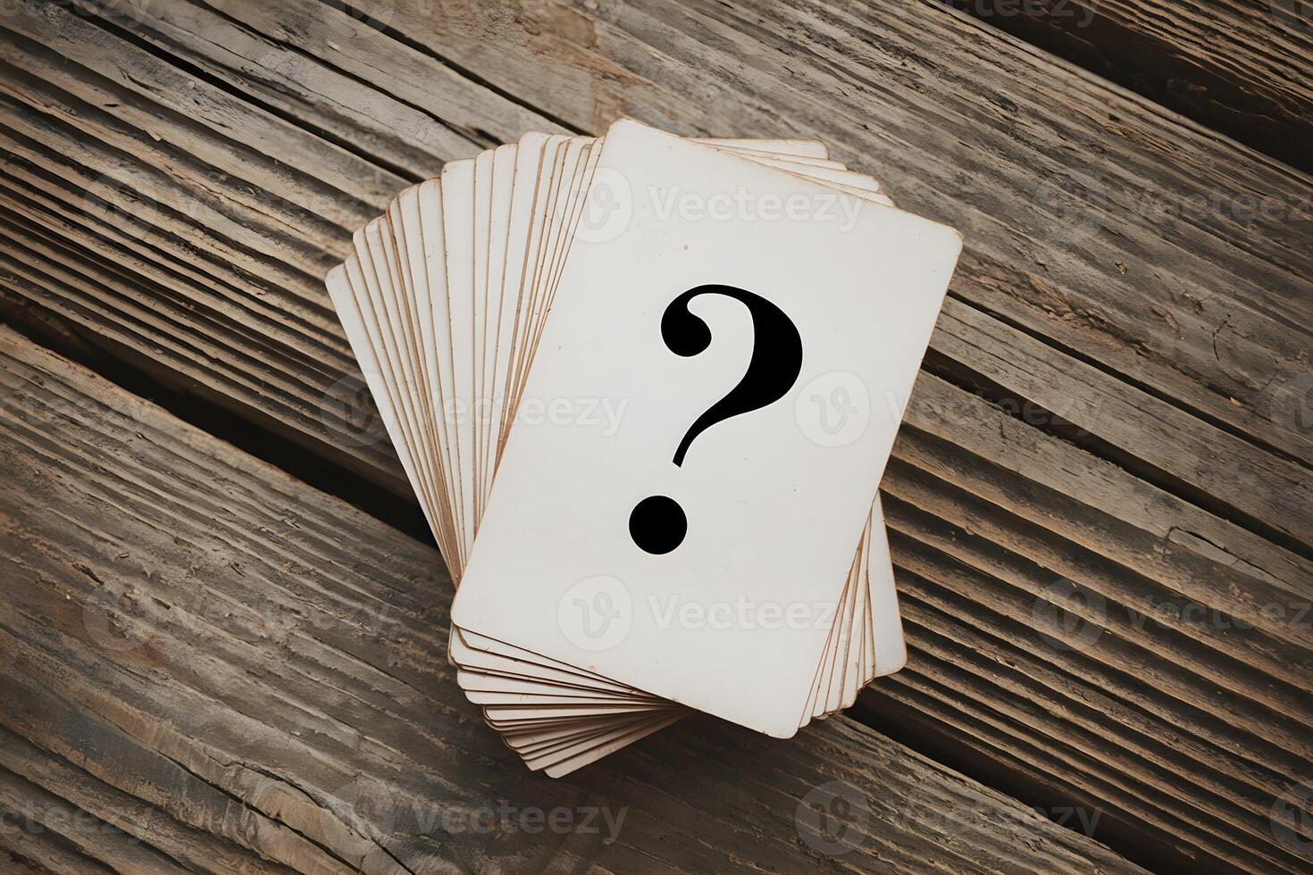 White cards on rustic wood, featuring question mark, evoke vintage curiosity photo