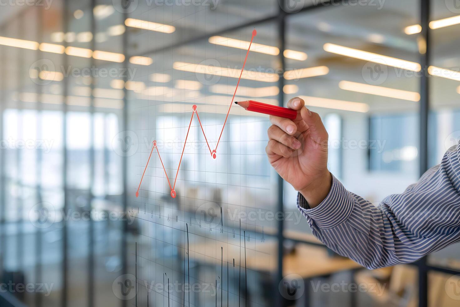 Gloved hand draws red zigzag line on modern transparent graph in office photo