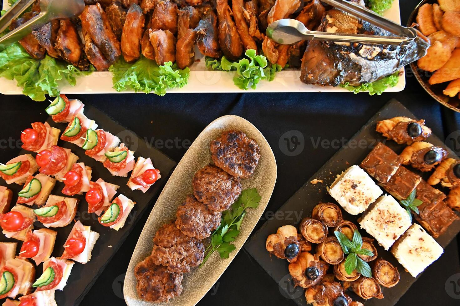 A buffet table with various types of food photo