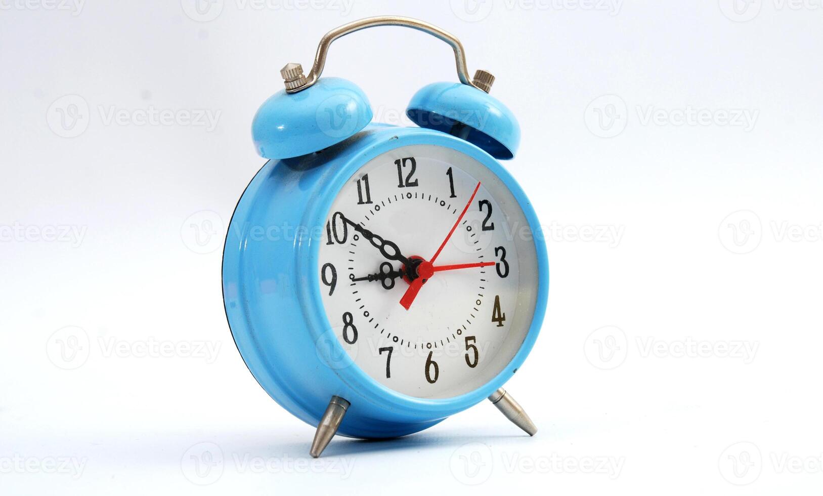blue alarm clock on a white background photo