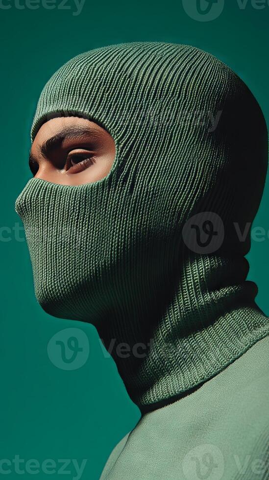 Closeup Portrait of a Person Wearing a Green Knitted Mask photo