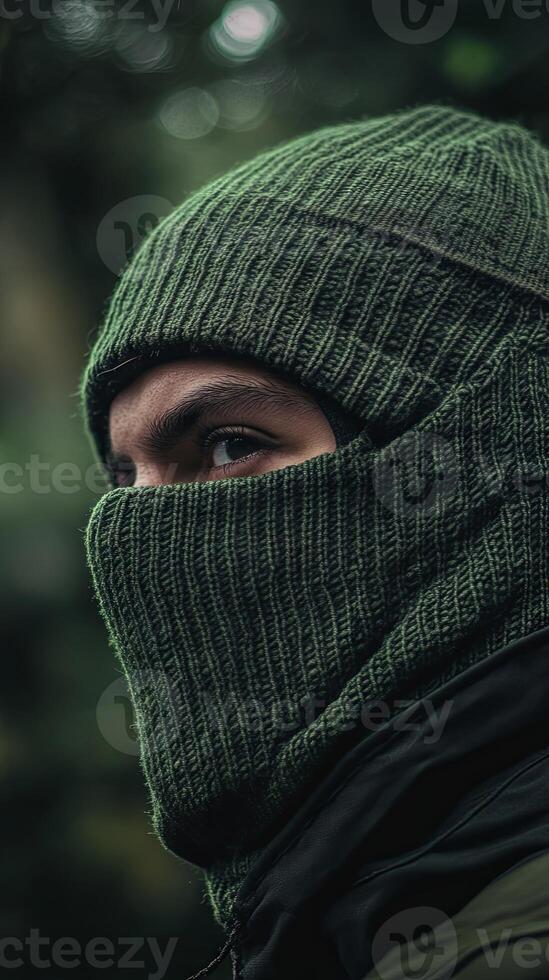 Mysterious Figure in Deep Forest Green Mask photo