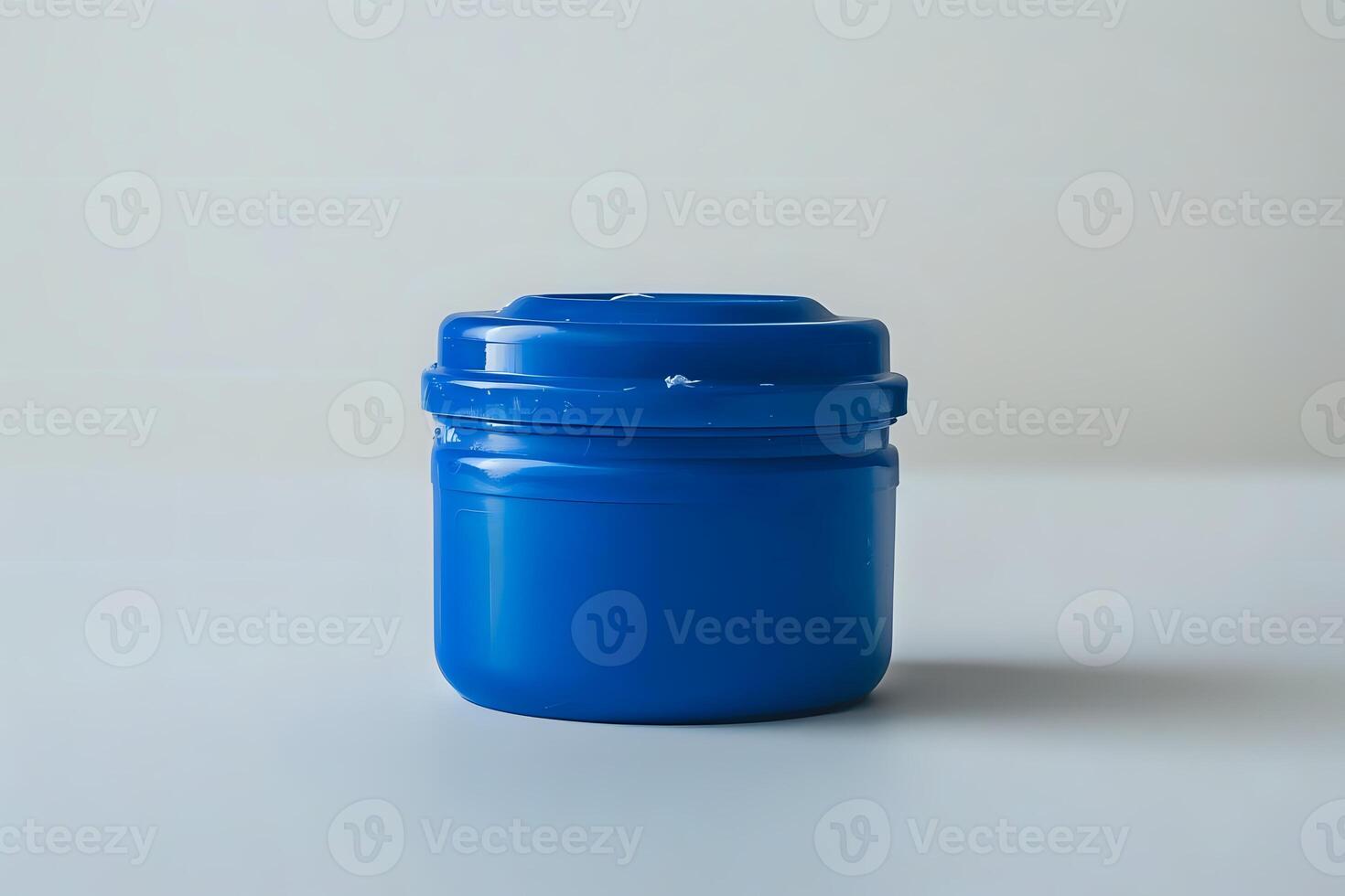 Exploring the Design of a Simple, Cylindrical, Blue Plastic Container with a Snap-On Lid. A Study in Everyday Object Aesthetics and Functionality, Examining Material Choices and Manufacturing Process photo