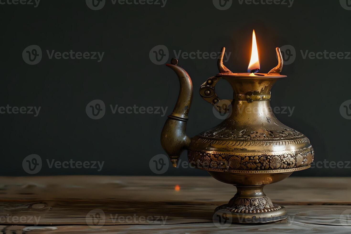 Ornate Antique Oil Lamp Burns Brightly on Rustic Wood, Illuminating the Intricate Metalwork with a Warm, Golden Glow, Creating a Serene and Peaceful Atmosphere. A Symbol of Hope and Tradition. photo