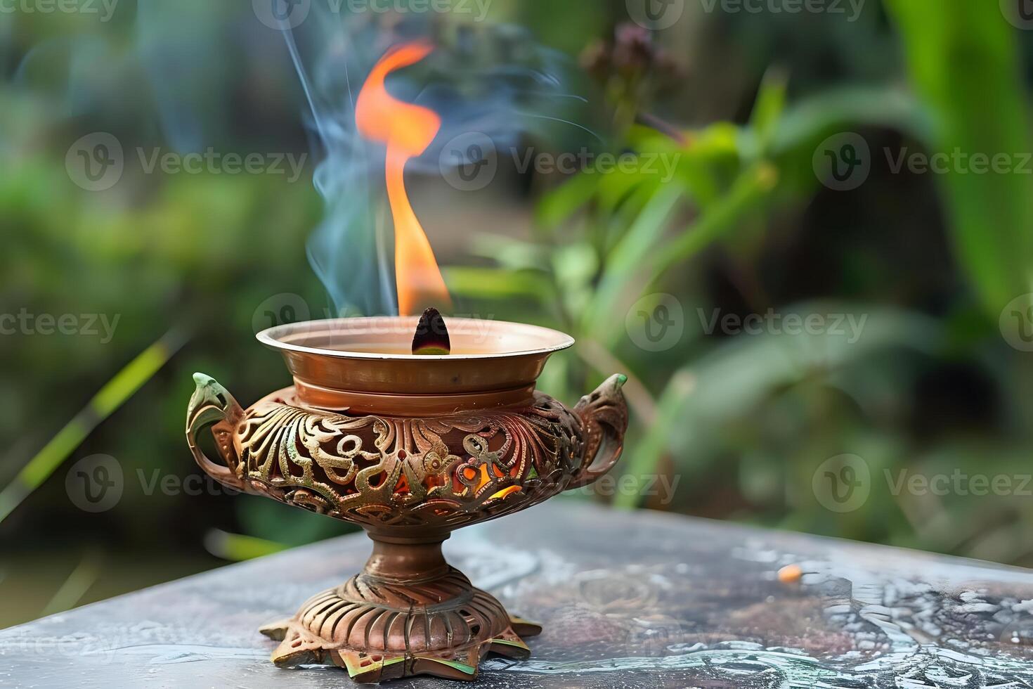 Ornate Metal Incense Burner with Burning Incense, Producing Aromatic Smoke and Glowing Embers, Outdoors in a Tranquil Garden Setting. Spiritual Ritual and Peaceful Atmosphere. Moments of Serenity photo