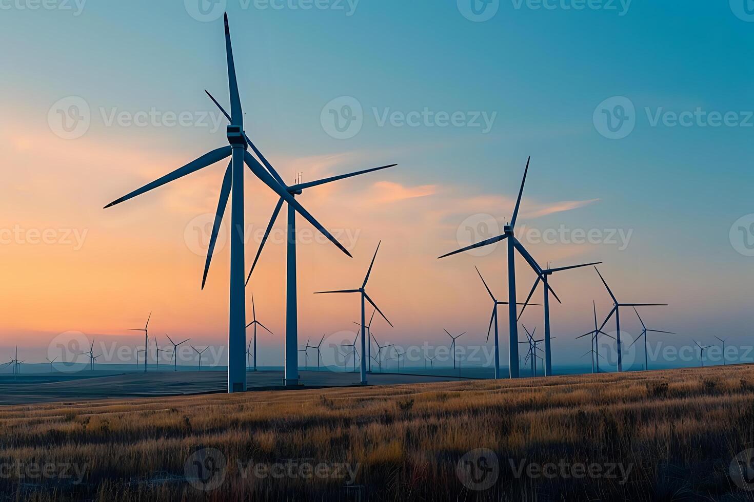 Wind Turbines Generate Clean Energy in a Serene Landscape at Sunset, Harnessing Nature's Power for a Sustainable Future, Representing a Transition to Renewable Resources. photo
