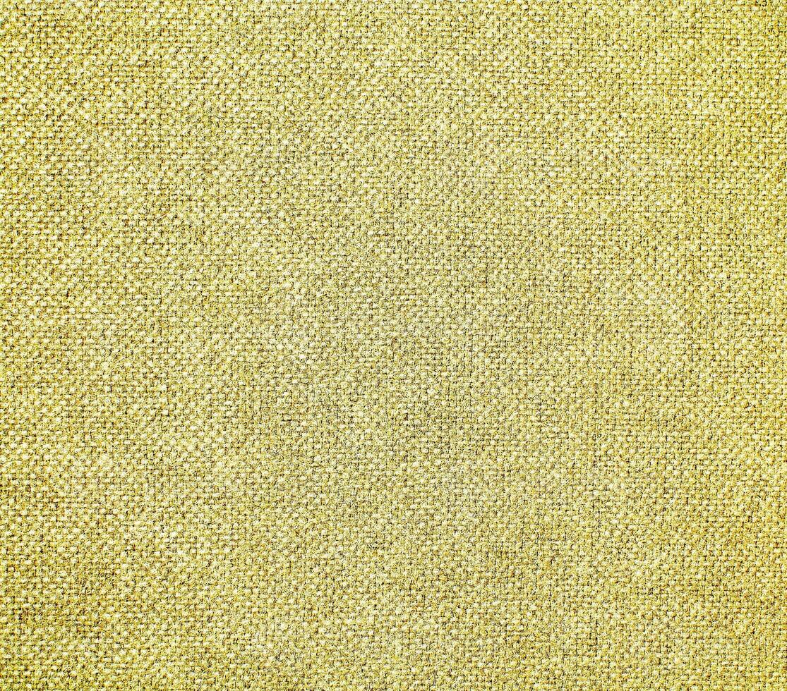 A yellow fabric background with a light green color photo