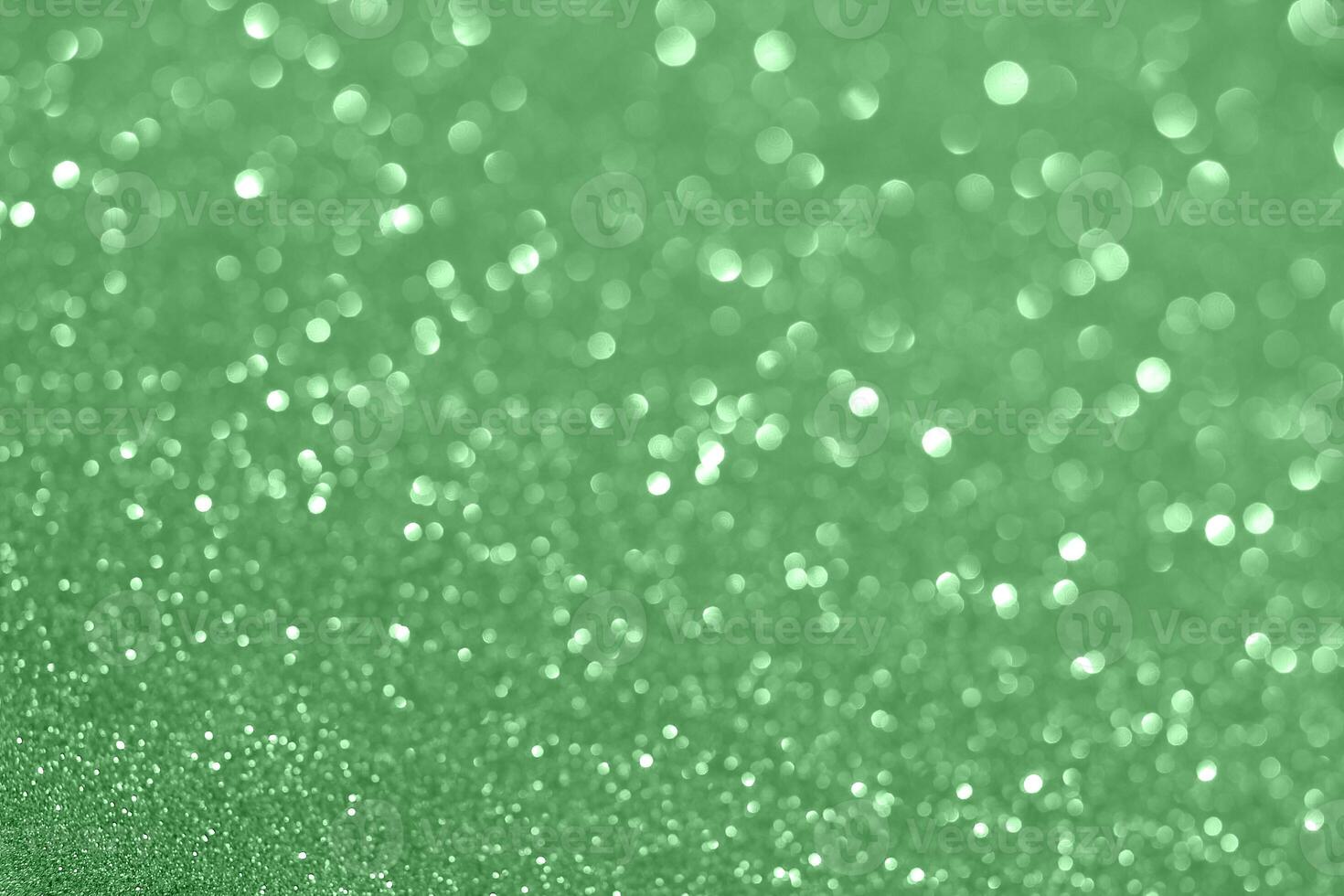Green glitter background with white dots photo