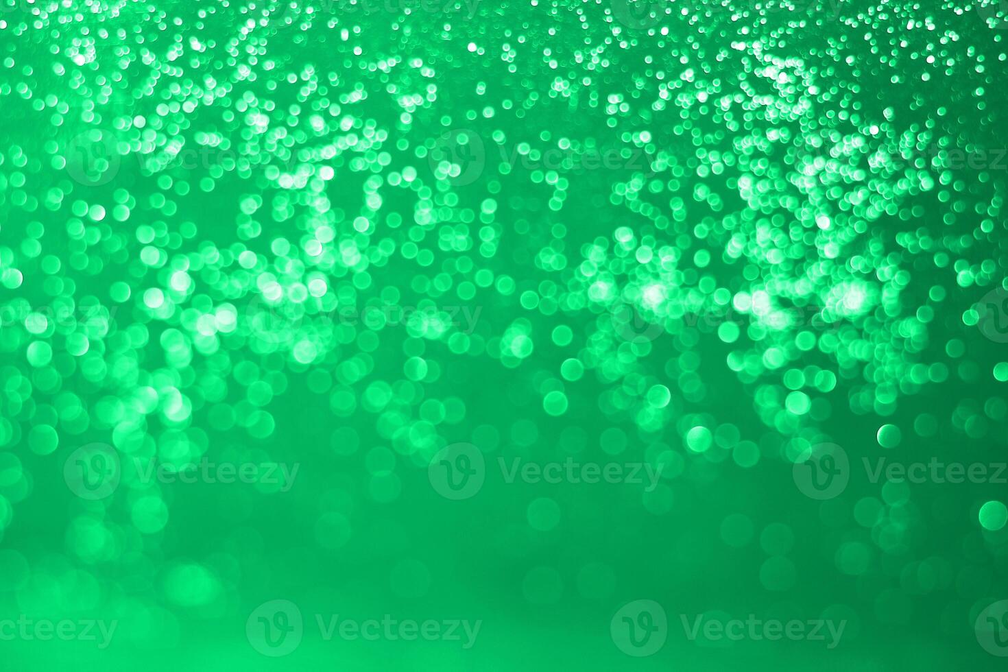Green bokeh background with sparkles photo