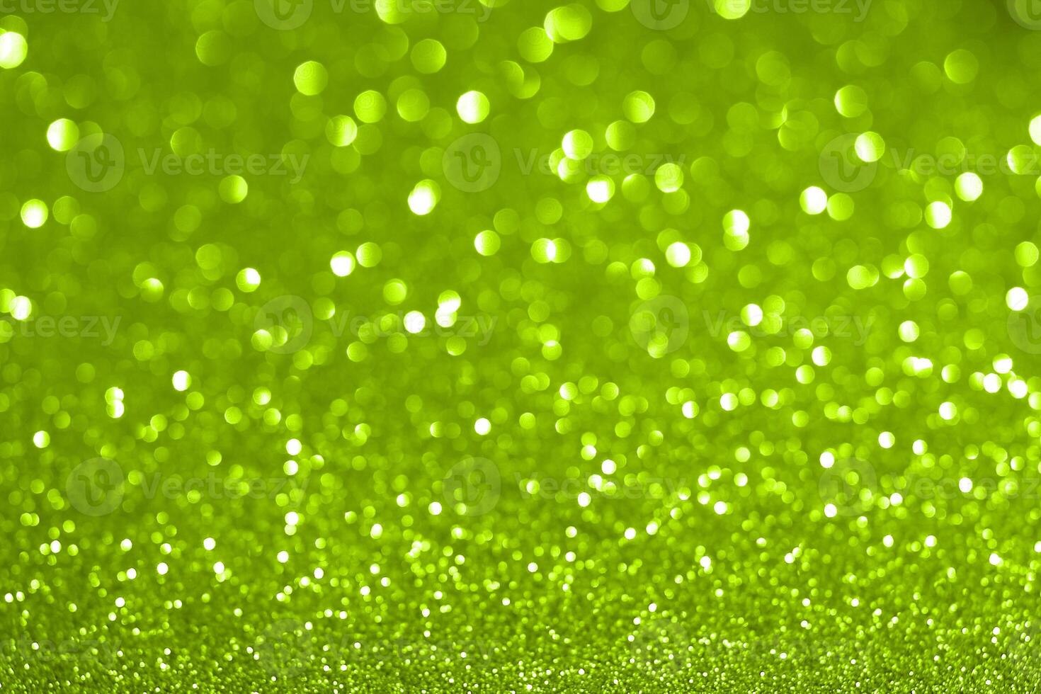 Green glitter background with bright lights photo