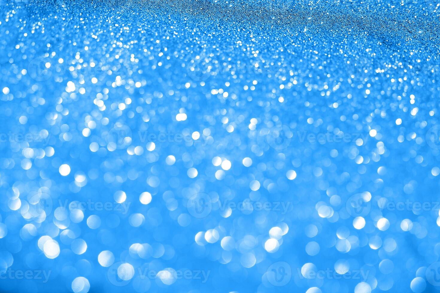 A blue background with white snowflakes photo
