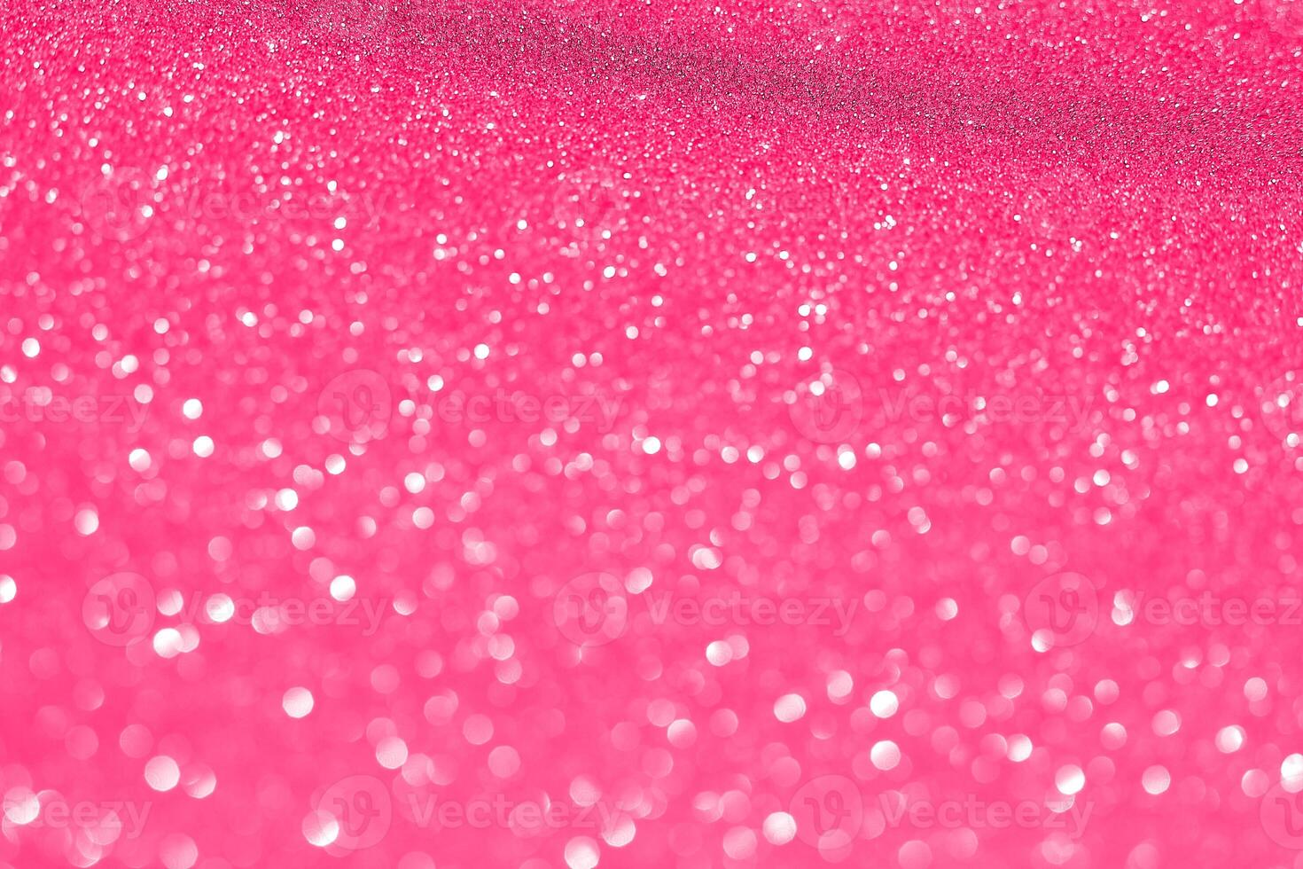A pink glittery background with lots of sparkles photo