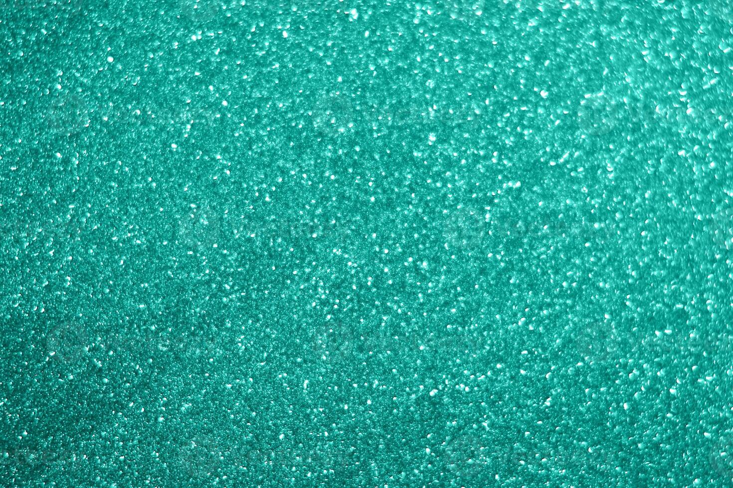 A close up of a green glitter background photo