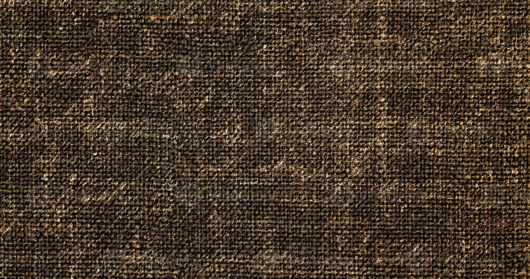 A brown, textured fabric background photo