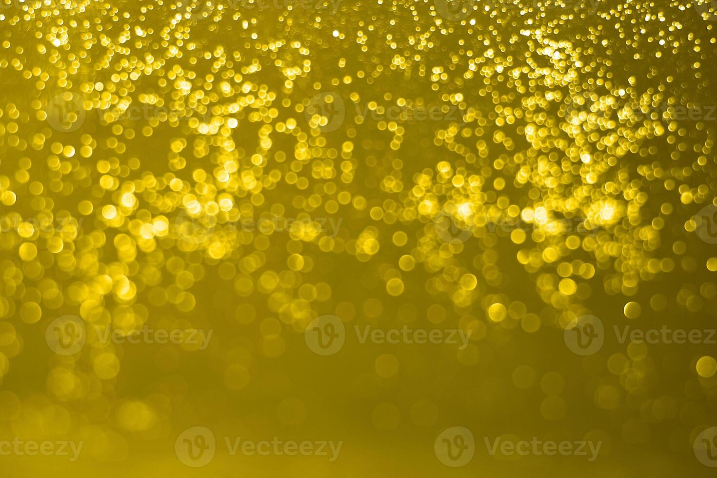 Golden sparkles on a black background photo