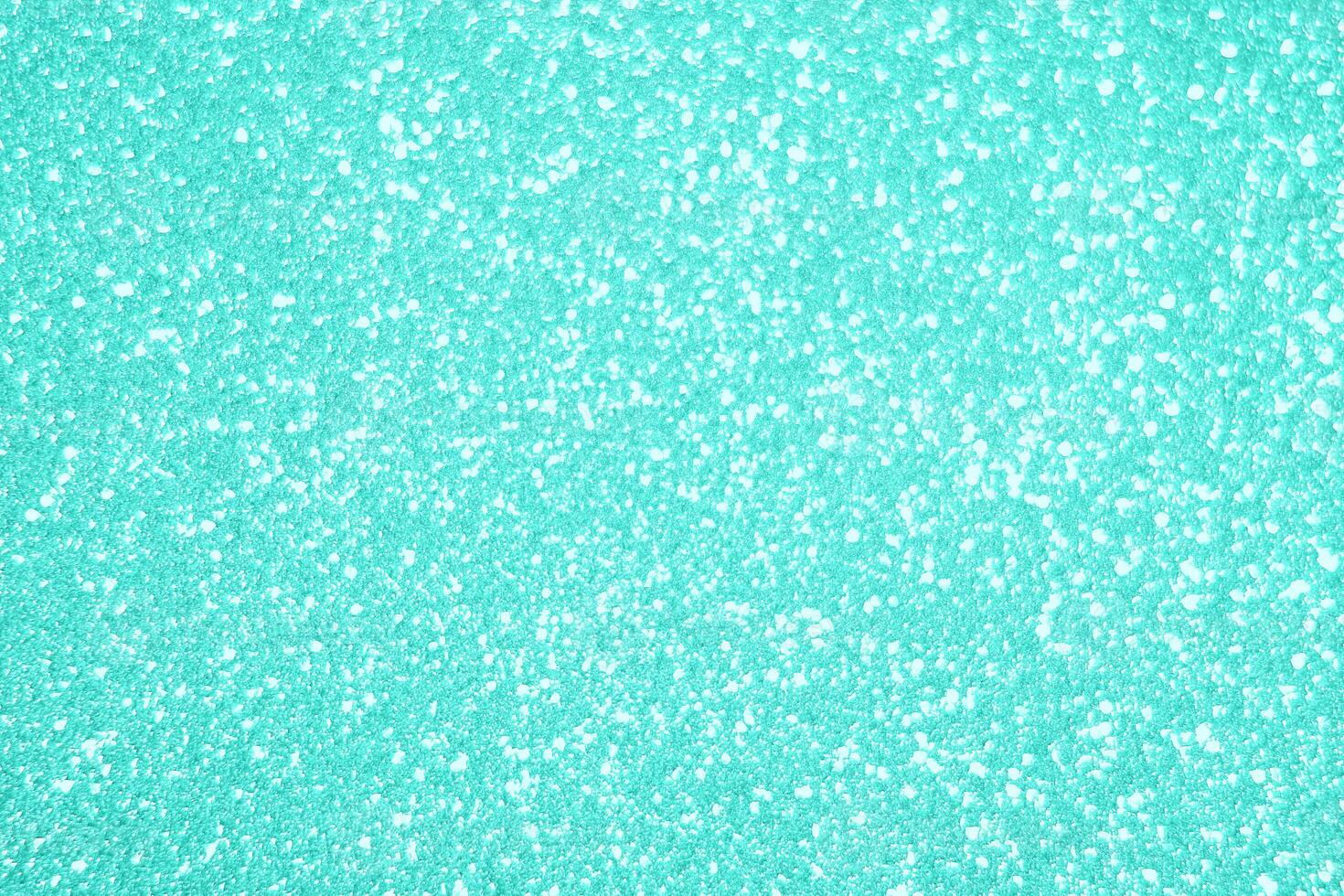 A close up of a turquoise colored surface photo