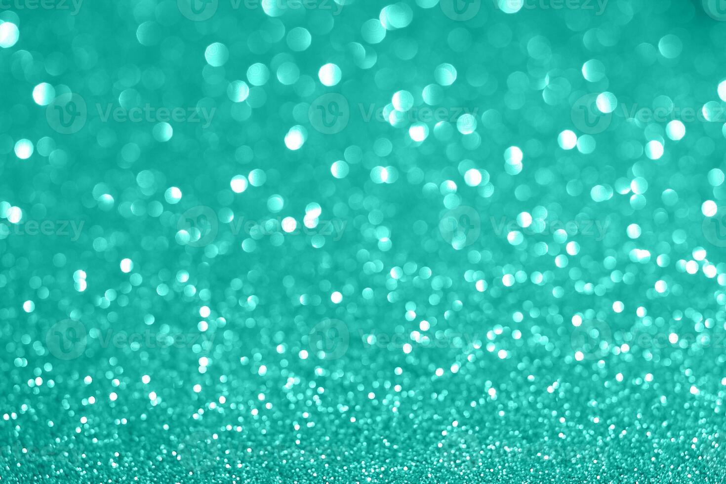 A blue glitter background with a lot of sparkles photo