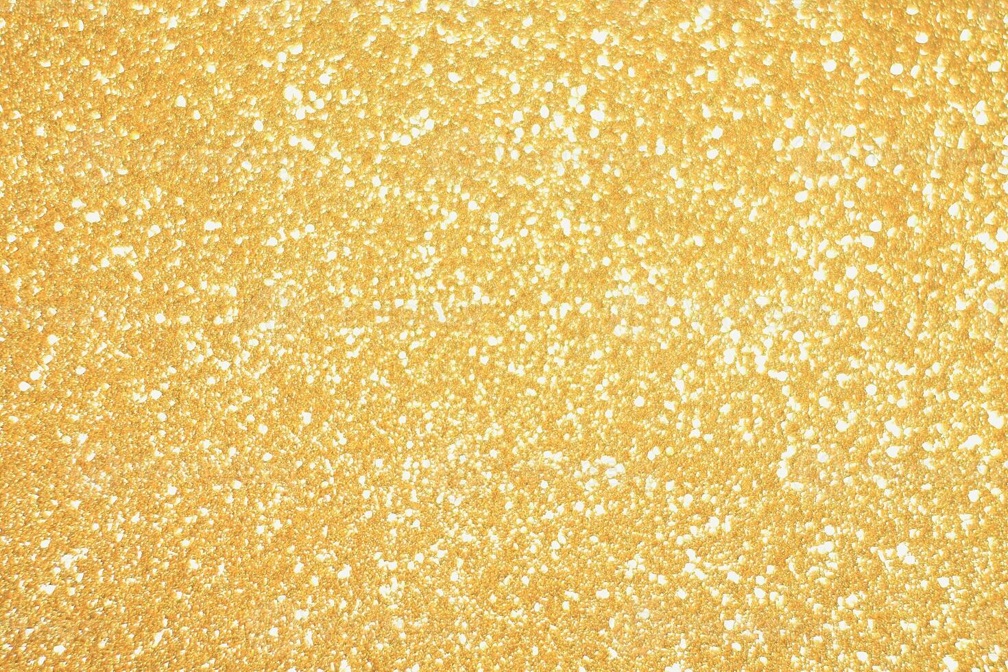 A close up of a gold glittery surface photo