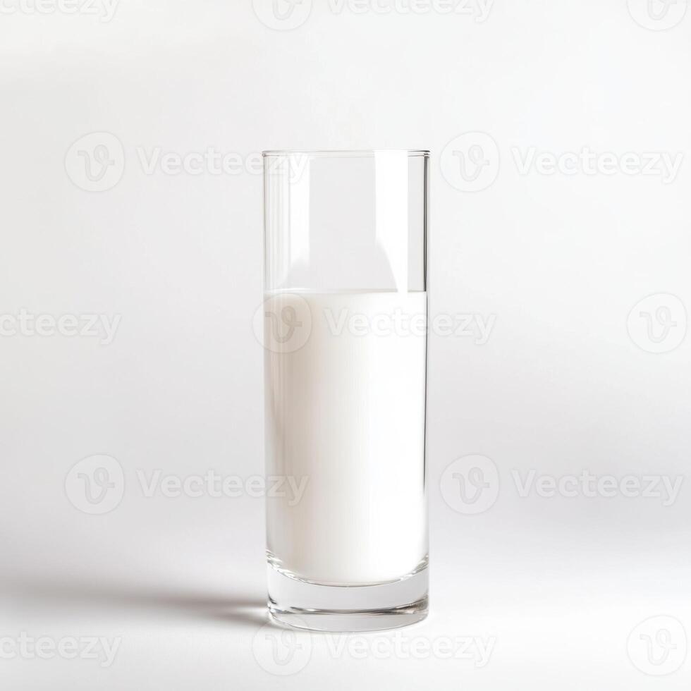 Tall glass filled with fresh milk against a simple background in a well-lit setting photo
