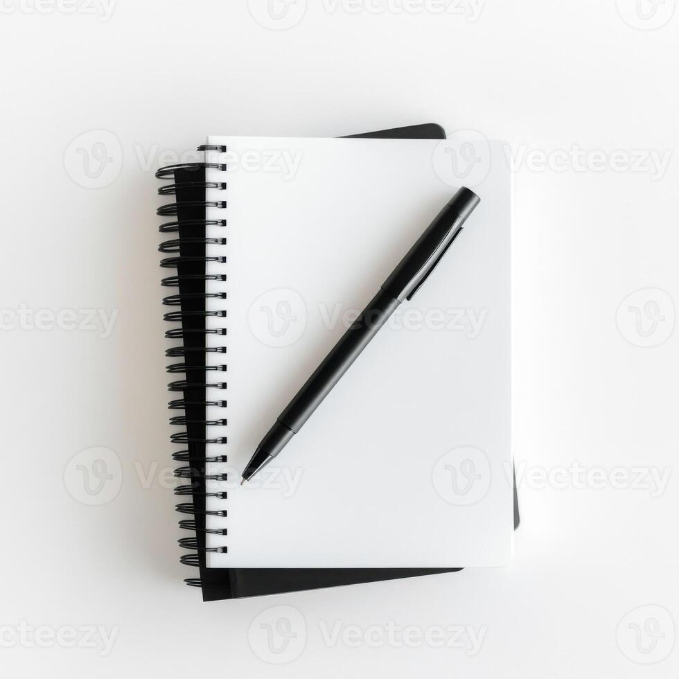 Blank notebook and black pen ready for creative ideas and notes on a clean surface photo