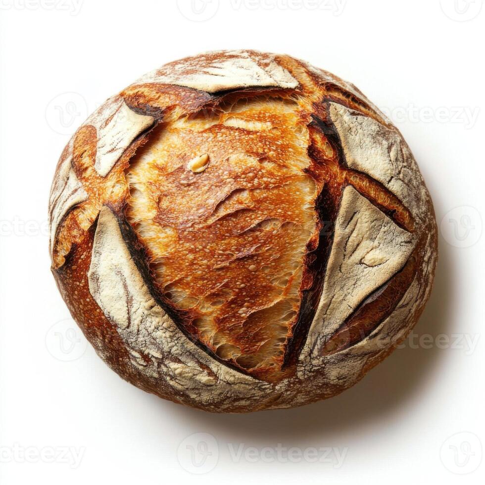 Freshly baked round sourdough bread with a golden crust and artistic scoring design on a clean white background photo