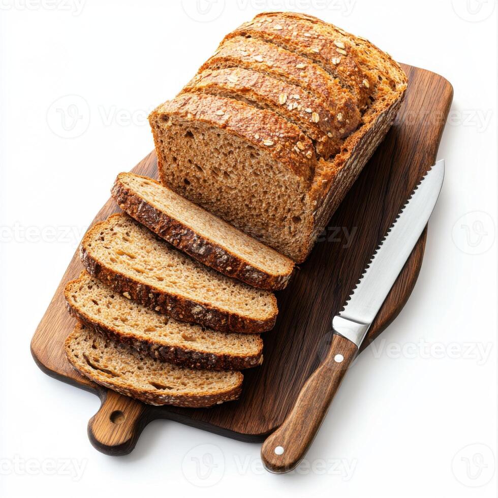 Freshly baked whole grain bread displayed on a wooden cutting board with slices ready for serving at a cozy kitchen setting photo