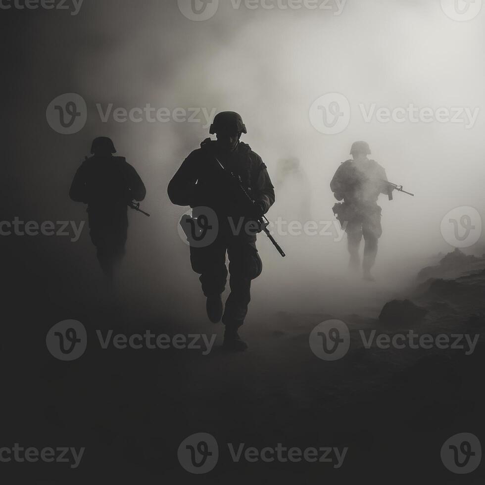 Soldiers navigating through foggy terrain during a military operation at dawn photo