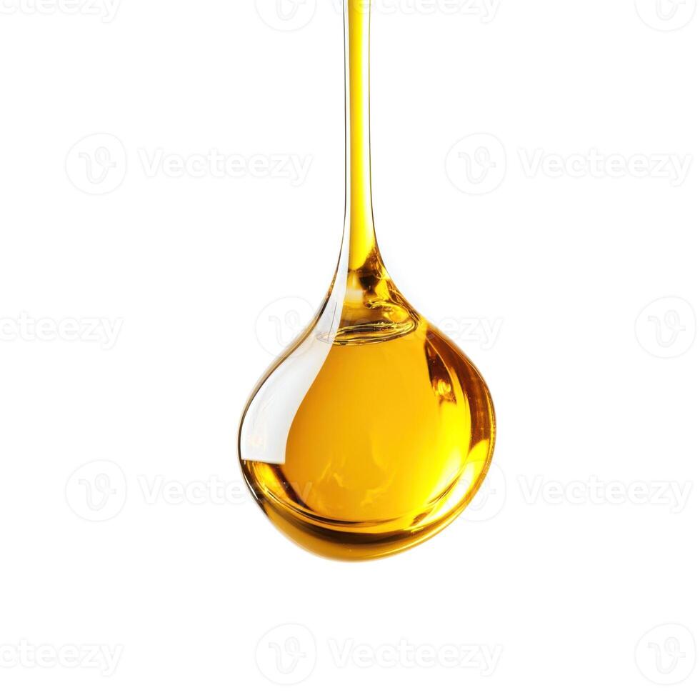 Golden liquid drips gracefully from a spoon, showcasing its smooth texture and rich color photo