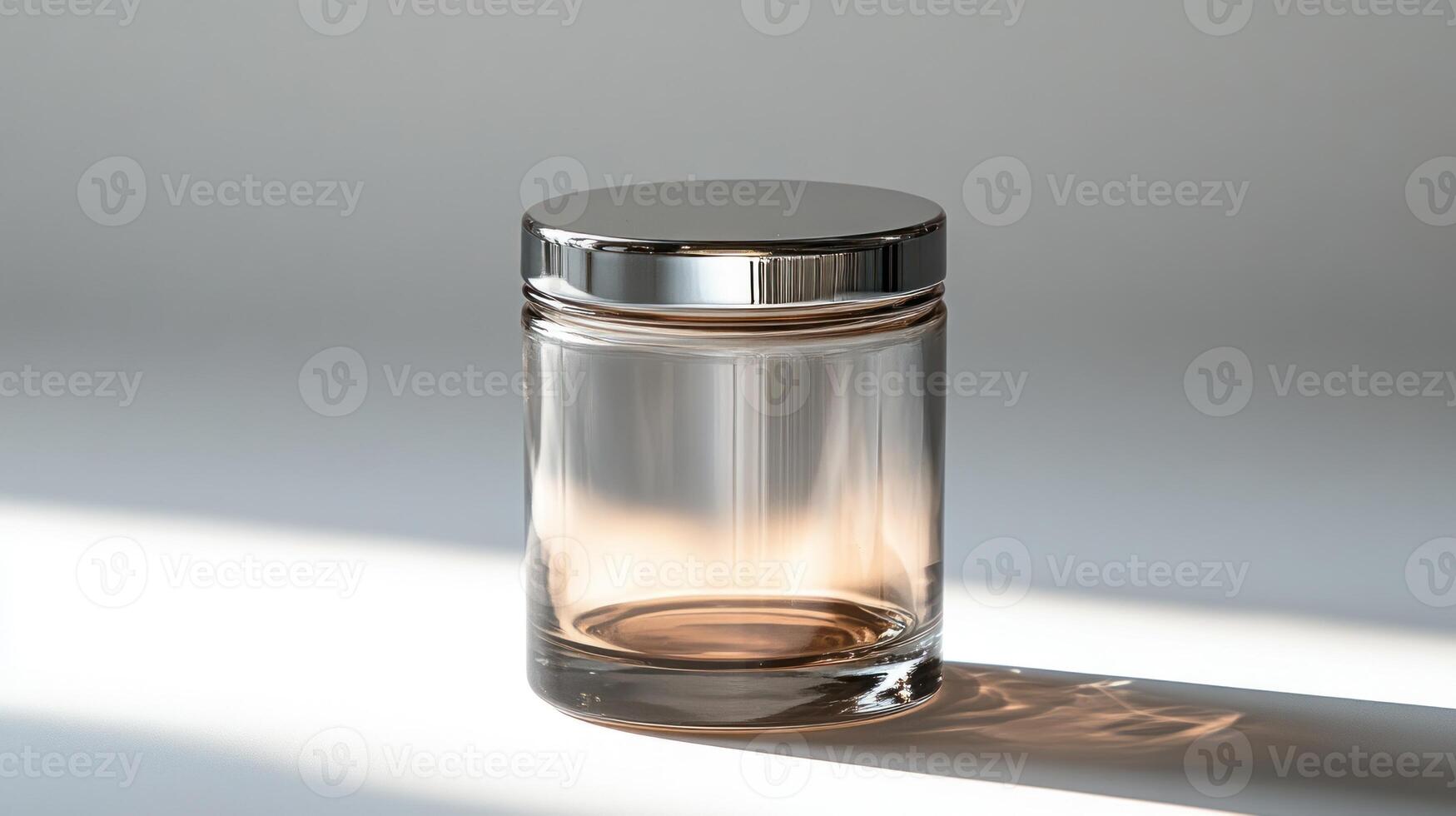 A beautiful glass jar reflects soft sunlight, casting delicate shadows around it photo