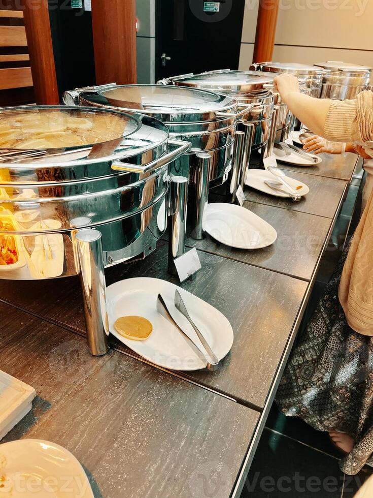 Lined up in the hotel buffet are several machines dedicated to keeping the food at the right temperature. photo